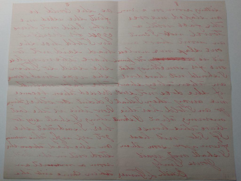 Color photograph of two pages of a letter, written in red ink and signed “Yours Truly Edith L. Turner.”